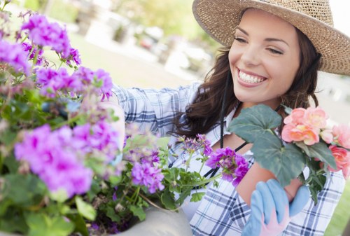 Person reviewing a landscaping concern form in a garden setting
