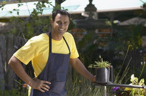 Worker wearing PPE during a landscaping project in Barnet